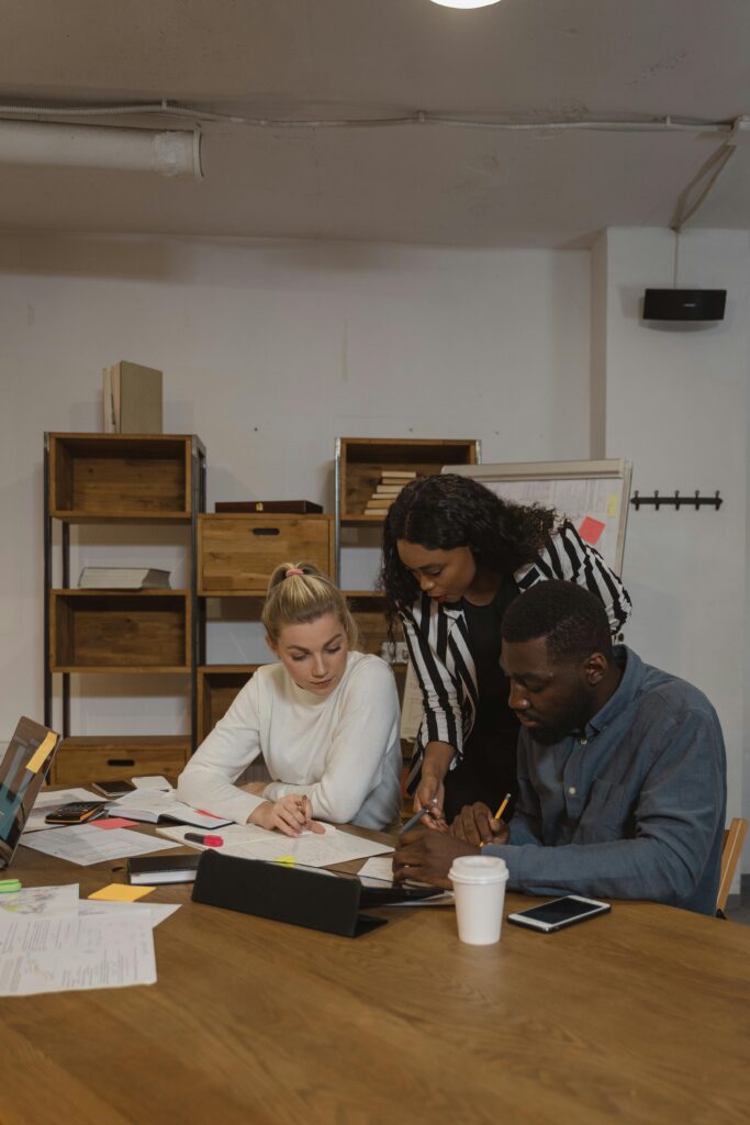 Woman looking at her Colleague's Work